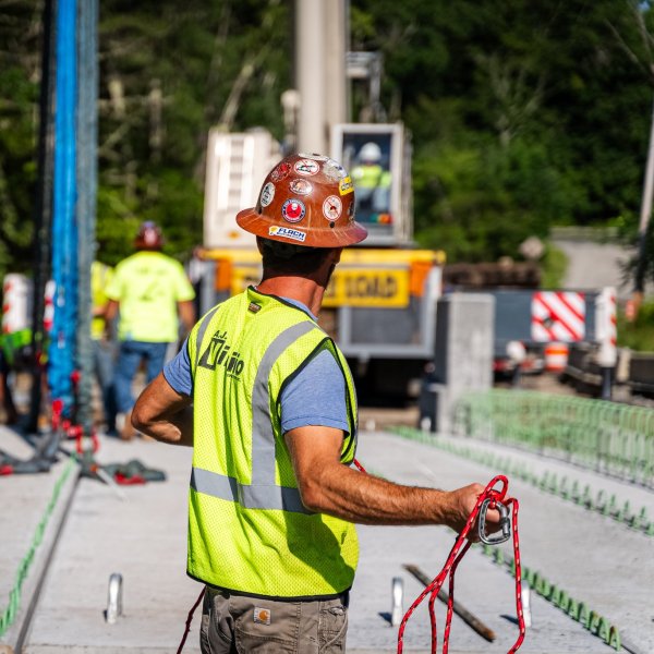 Man in hard hat working on bridge construction